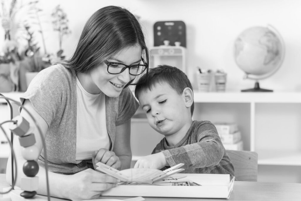 A caregiver reading with a young child