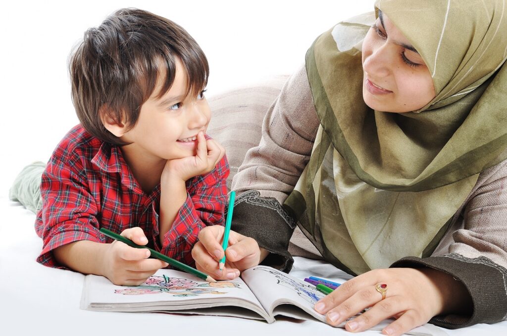A caregiver reading with a young boy